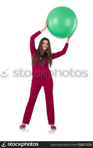 Young woman with ball exercising on white