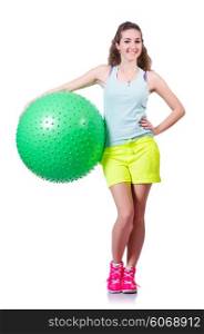 Young woman with ball exercising on white