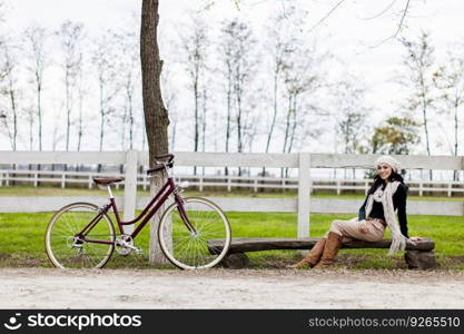 Young woman with bicycle