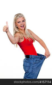 young woman with big pants after a successful diet: