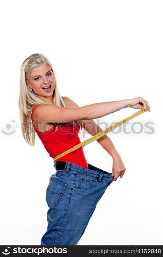 young woman with big pants after a successful diet: