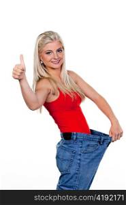 young woman with big pants after a successful diet: