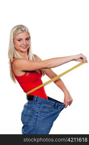 young woman with big pants after a successful diet: