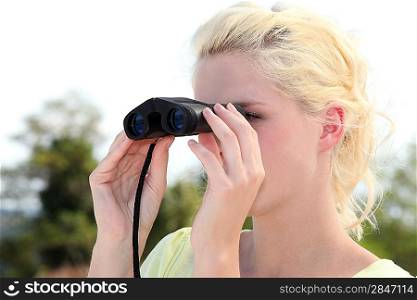 Young woman with binoculars