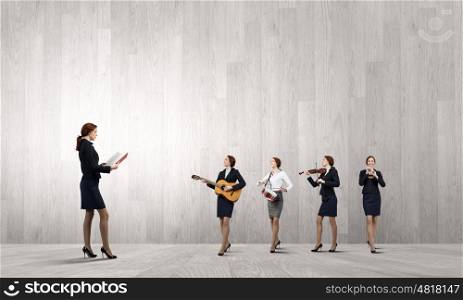 Young woman with book and playing different music instruments. One man band