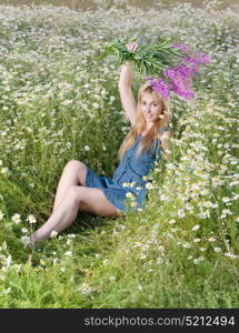 young woman with bouquet of firetop flower in the field