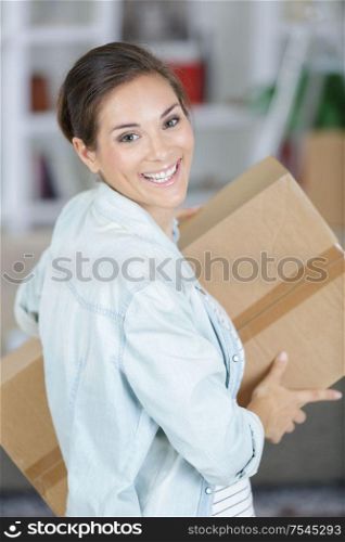 young woman with boxes - move concept