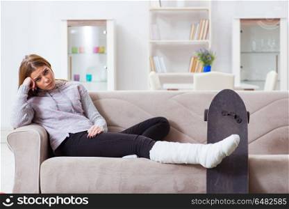 Young woman with broken leg at home