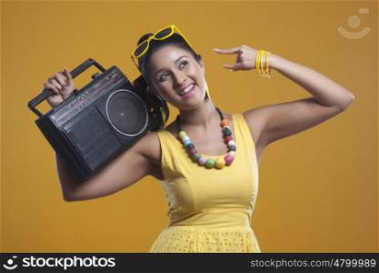 Young woman with cassette player