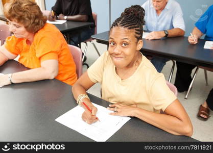 Young woman with cerebral palsy in college class.