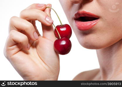 Young woman with cherry isolated on white