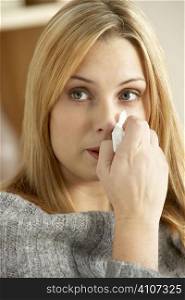 Young Woman With Cold Blowing Nose