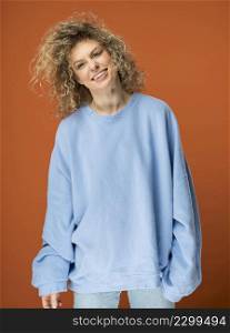 young woman with curly blonde hair smiling 3