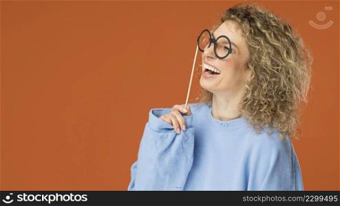 young woman with curly blonde hair smiling 4