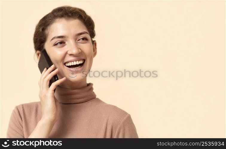 young woman with curly hair using mobile phone 2