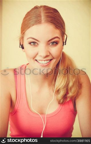 Young woman with earphones listening to music. Girl relaxing enjoying. People relax leisure pleasure concept.. Woman with earphones listening to music. Leisure.