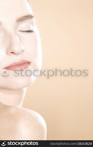 Young woman with eyes closed