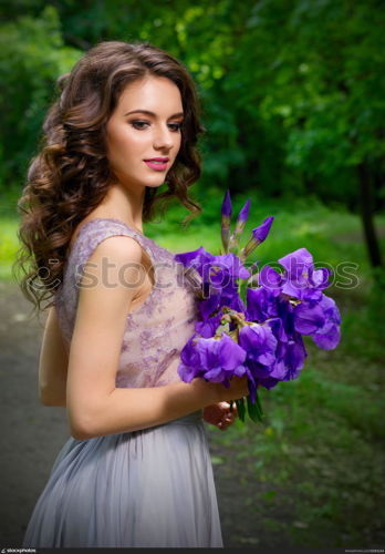 Young woman with flowers in the forest (without sunrays ver)