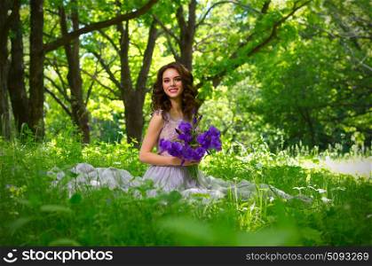 Young woman with flowers in the forest (without sunrays ver)