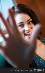 Young Woman with Hand in Shot