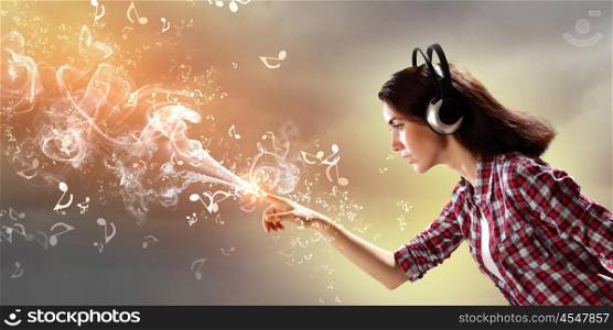 Young woman with headphones. Image of young pretty woman with headphones. Side view