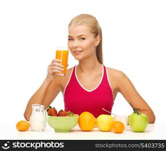 young woman with healthy breakfast and drinking orange juice