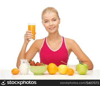 young woman with healthy breakfast and holding orange juice