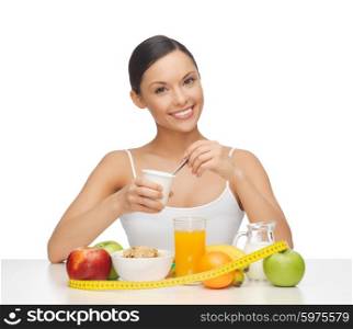 young woman with healthy breakfast and measuring tape. woman with healthy breakfast and measuring tape
