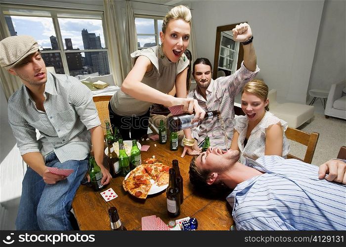 Young woman with her friends enjoying a party