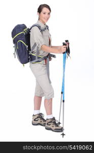 Young woman with hiking gears.