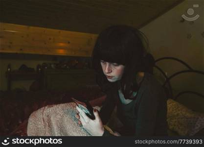Young woman with insomnia at night at home
