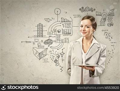 Young woman with ipad in hands. Image of young woman holding in hands ipad