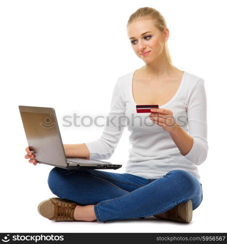 Young woman with laptop and plastic card isolated