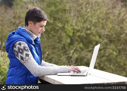 Young woman with laptop computer