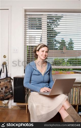 Young Woman with Laptop Computer