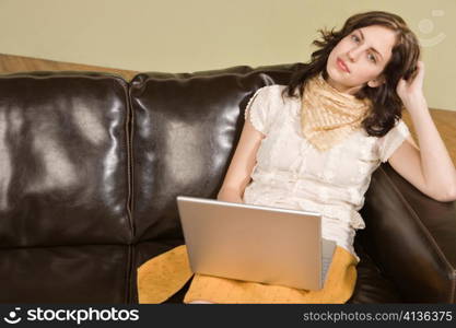 Young Woman with Laptop Looking Up