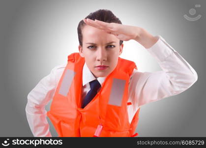 Young woman with life vest on white