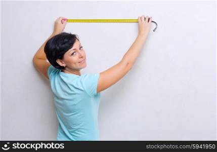 Young woman with measurement tape