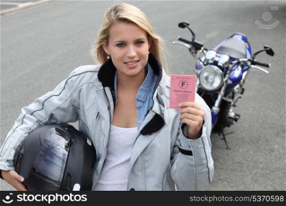 Young woman with motorcycle and French license