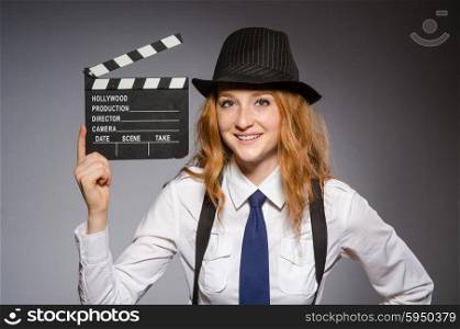 Young woman with movie board