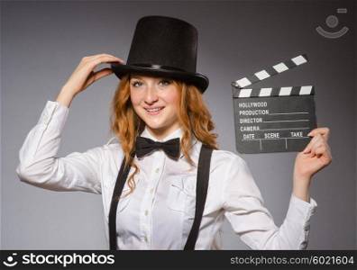 Young woman with movie board