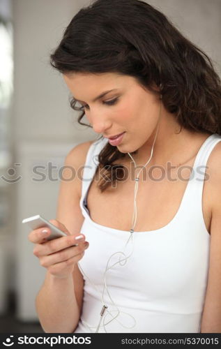 Young woman with music player