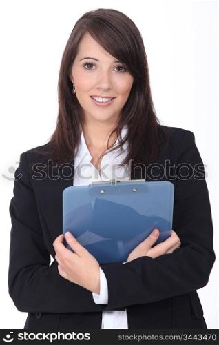 Young woman with notepad on white background