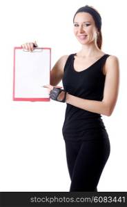 Young woman with notepad writing on white