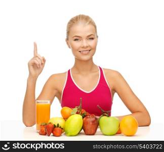 young woman with organic food or fruits holding finger up