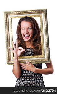 Young woman with picture frame on white