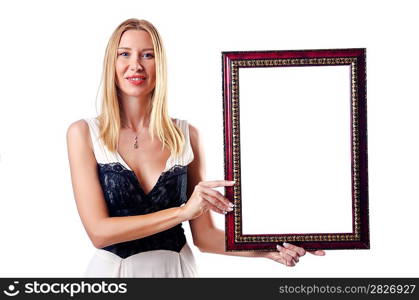 Young woman with picture frame on white