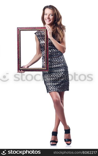 Young woman with picture frame on white