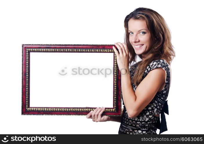 Young woman with picture frame on white