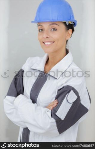 young woman with safety helmet looking at the camera